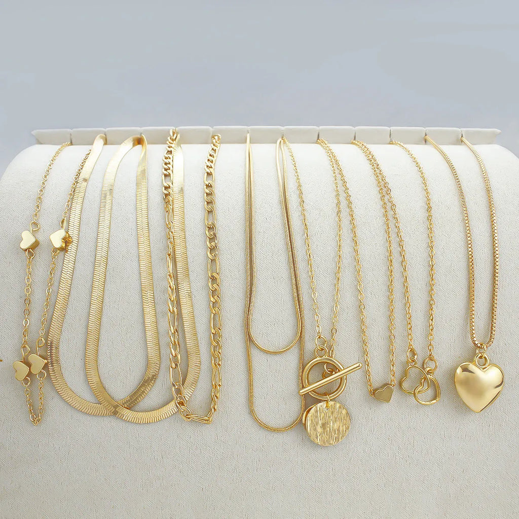 10-piece gold electroplated women's necklace set with simple alloy pendants on snake bone chains