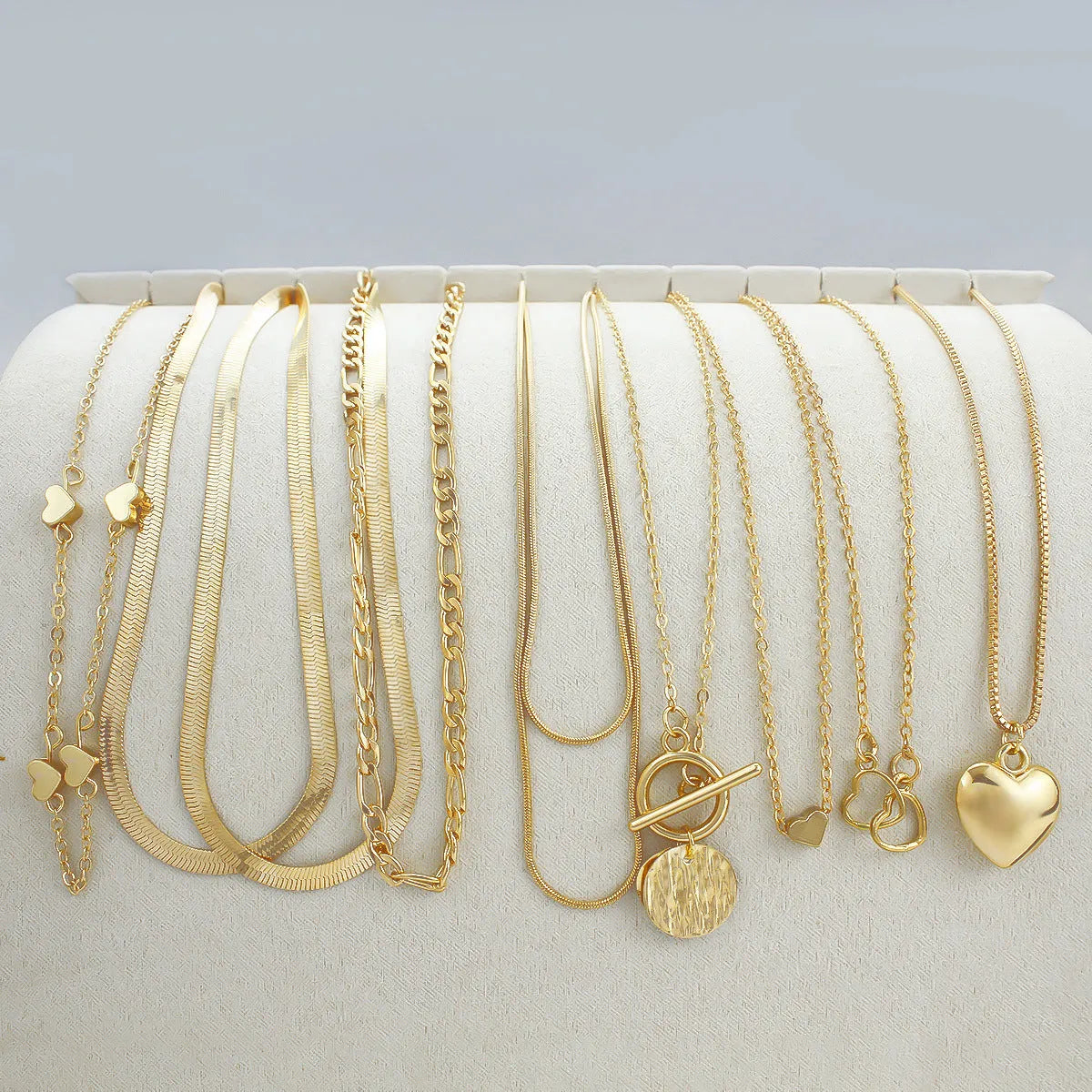 10-piece gold electroplated women's necklace set with simple alloy pendants on snake bone chains