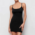 Black sleeveless sling dress with a mid waist and short skirt sheath silhouette.