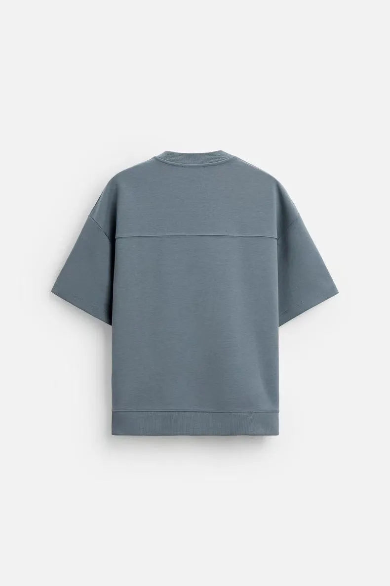 Loose double-sided cloth texture short sleeve shirt and matching shorts in blue, laid flat.
