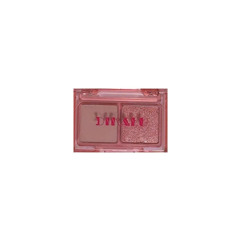 Two-tone eye shadow plate showing pink and black matte shimmer powder for punk makeup styles