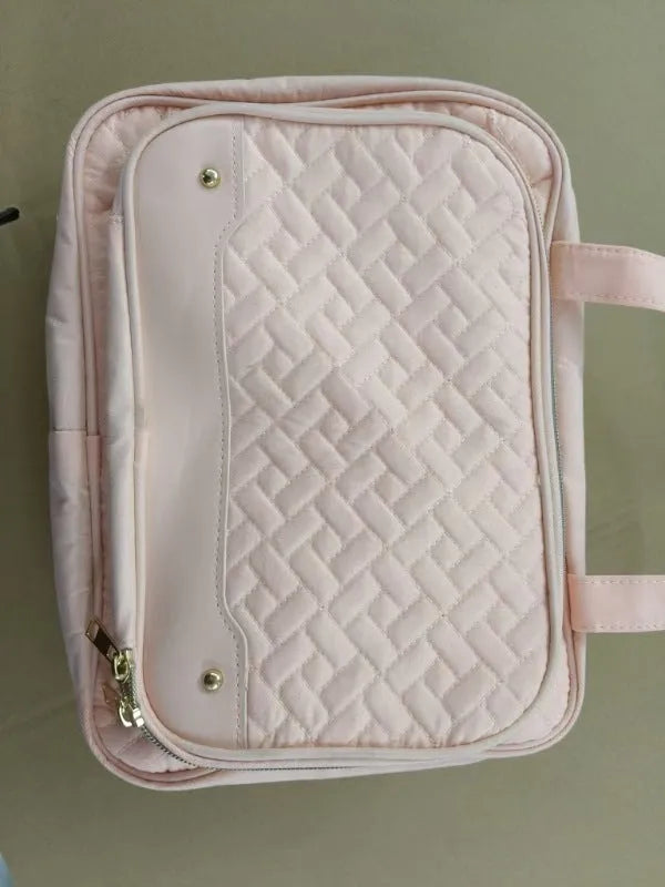 Black or pink waterproof hanging cosmetic bag with dimensions 30.5cm wide by 11cm deep by 22.9cm tall