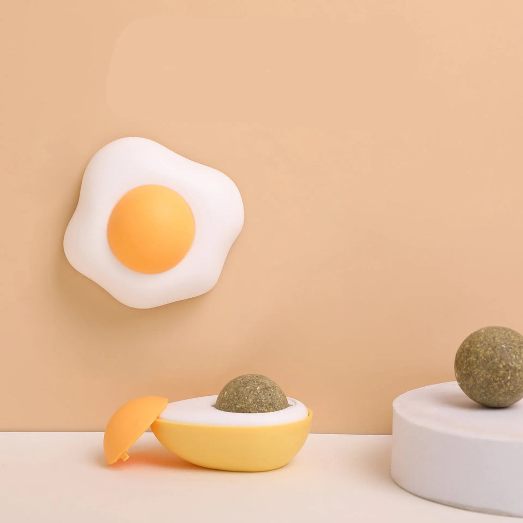 Interactive catnip ball toy in egg shapes with organic catnip filling for wall mounting