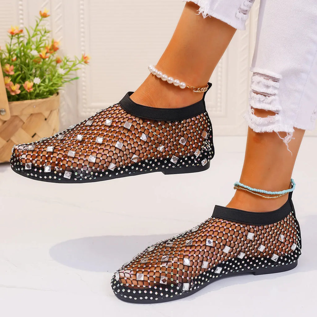 Women's colourful rhinestone and white mesh flat sandals on a rubber sole.