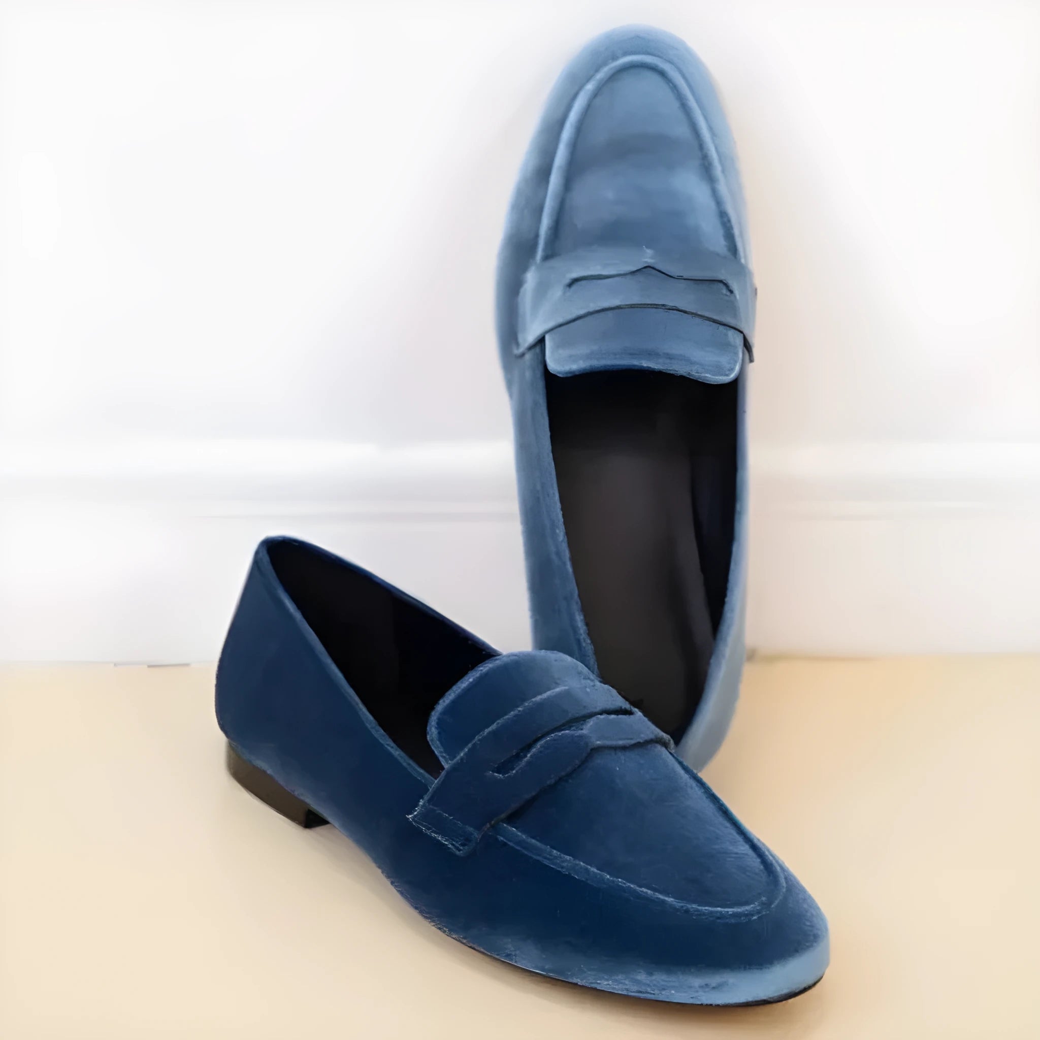 Blue and black artificial PU suede leisure loafers with a rubber sole on a white background.