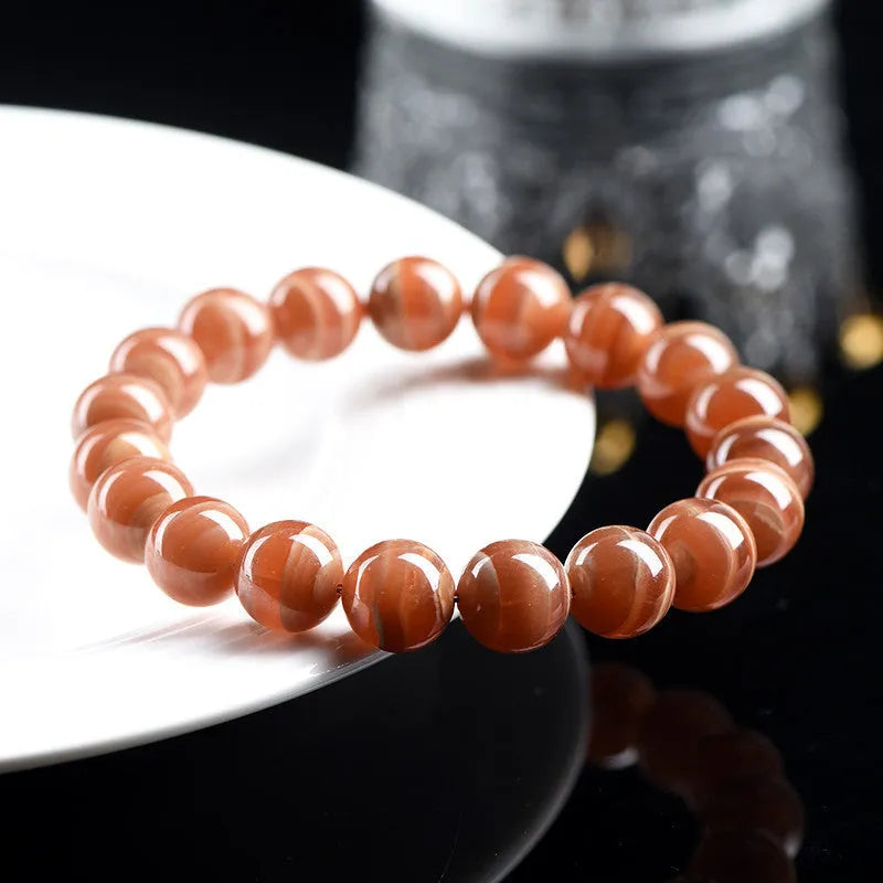 Natural old mine rhodochrosite round beads bracelet from Peru showing 6mm or 8mm geometry beads with Ruyi elements
