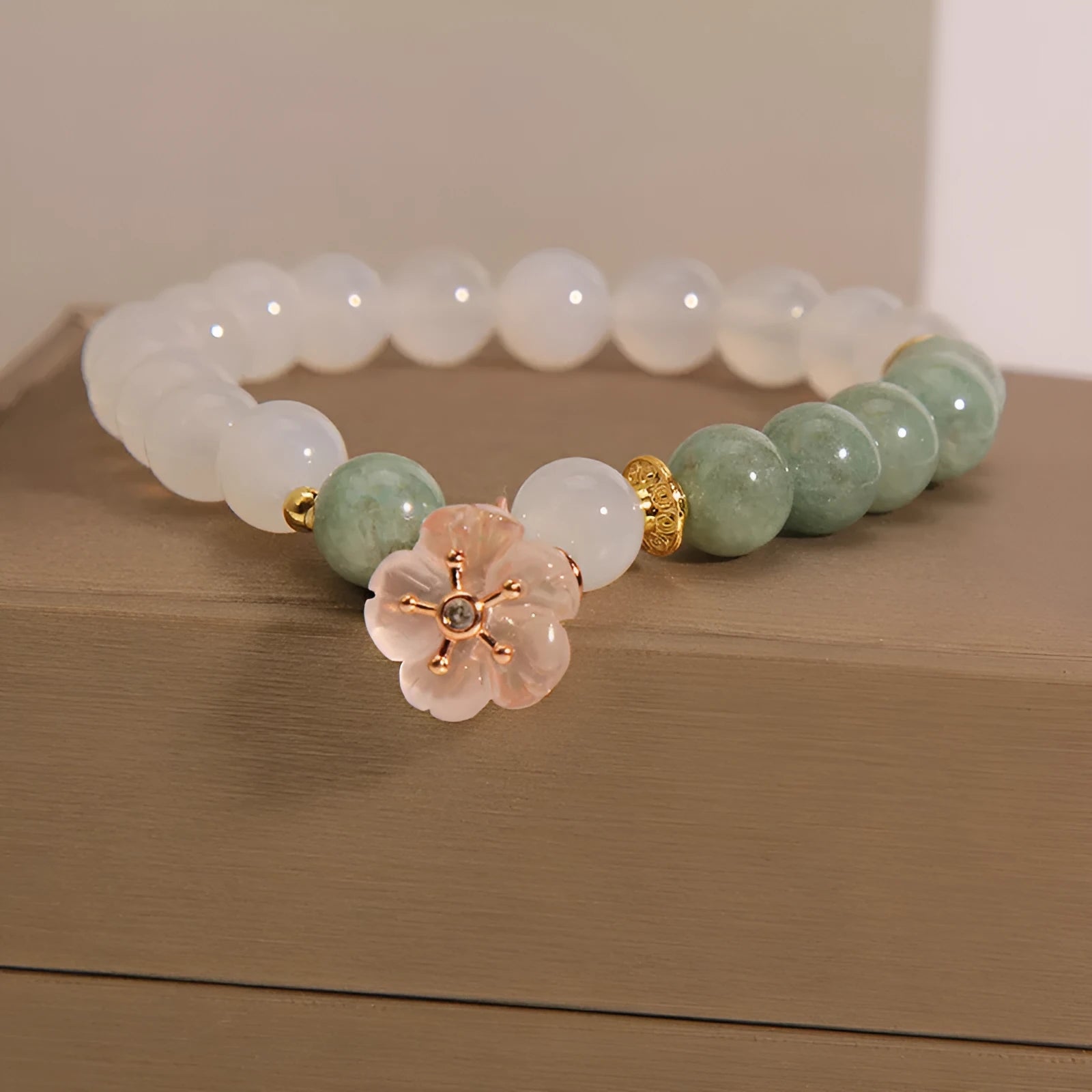 White agate and jade flower bracelet with pink accents on adjustable band