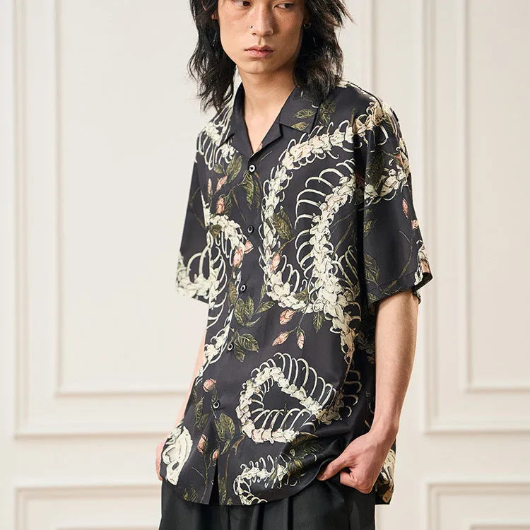 Short sleeve loose fit Cuban collar shirt with snake bone and floral printed pattern.