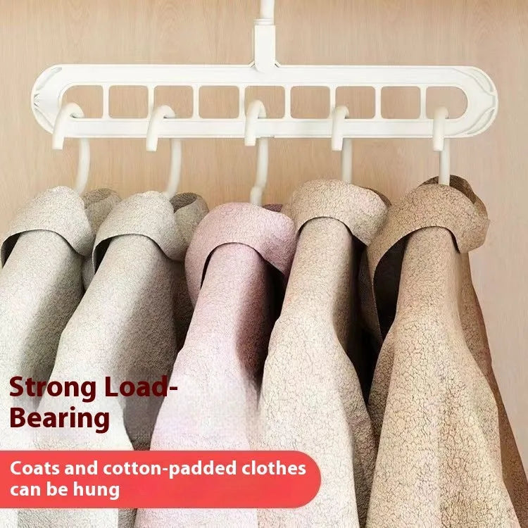 Green plastic multifunctional hanger with nine holes for trousers in a seamless folding pant rack design.