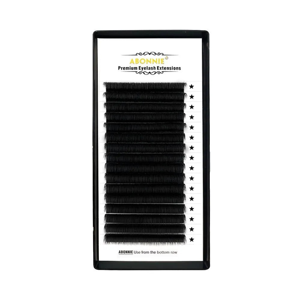 Close-up of dense 16-row matte mink hair false eyelashes on a clear band, showing natural finish.