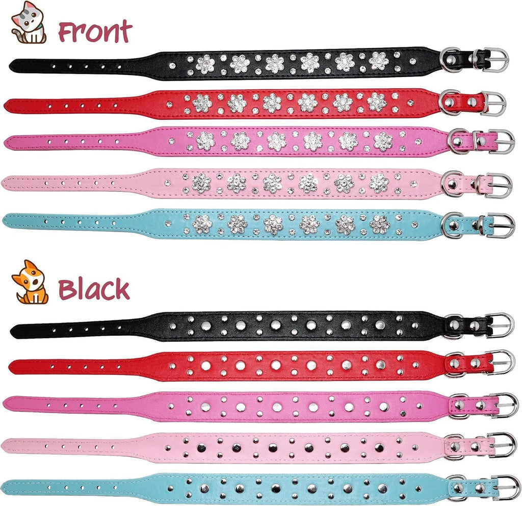 Close-up of a black PU leather dog collar with sparkling rhinestone flower studs and a metal D-ring