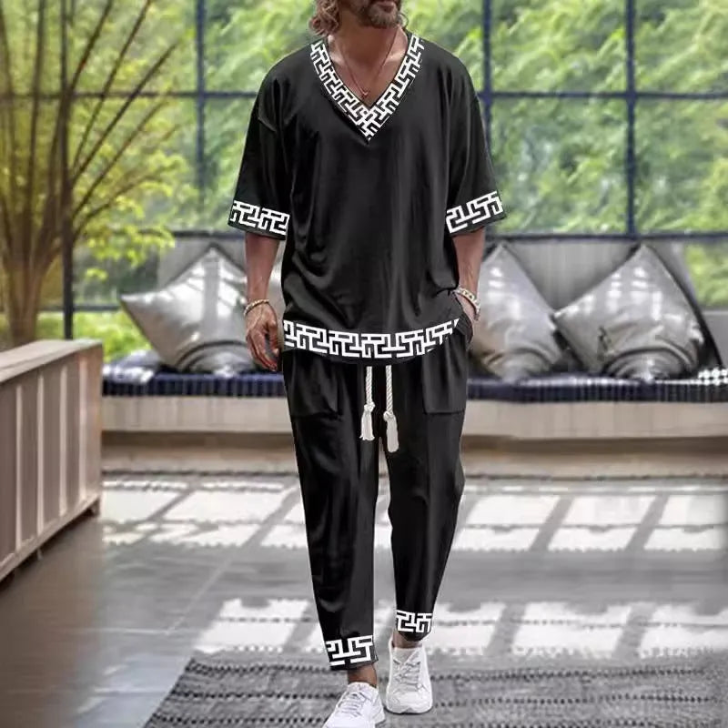 A women's polyester trousers suit set with a V-neck cropped sleeve jacket and matching trousers.