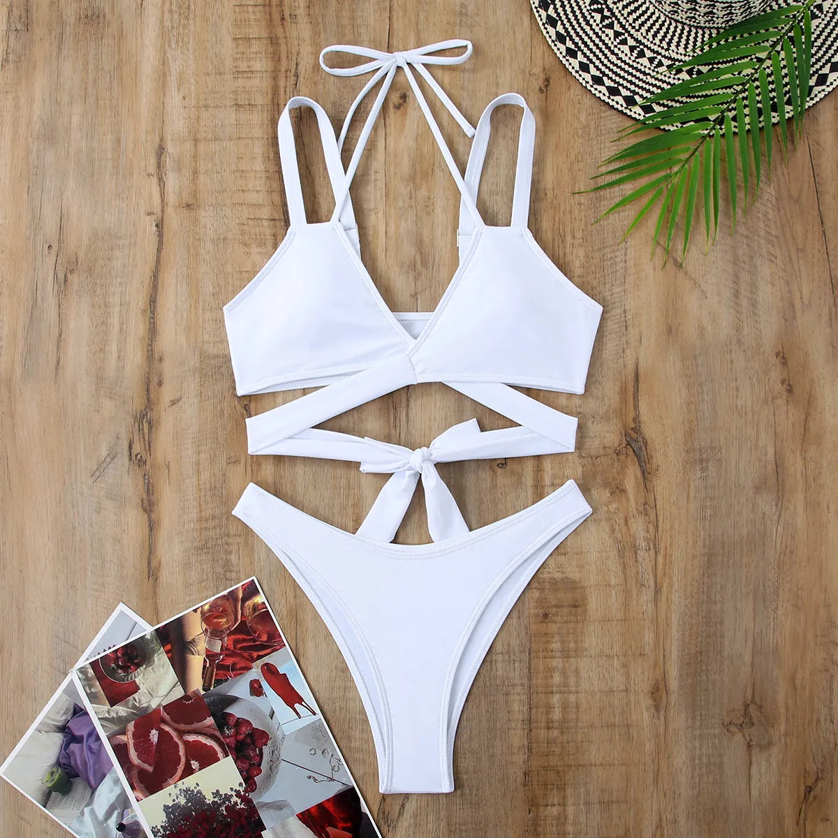 Women's solid colour strap bikini swimsuit in black, shown on a mannequin.