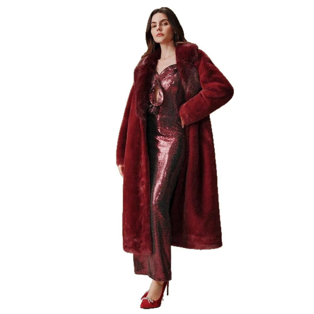 Woman wearing a long camel faux fur coat with regular sleeves, suitable for autumn and winter.