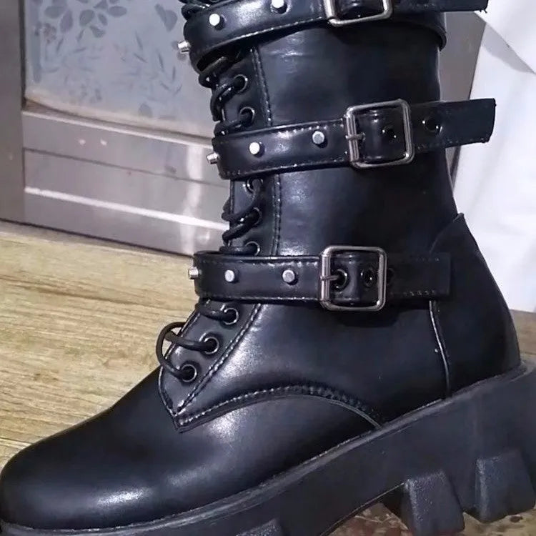 Women's black mid-calf boots with round toe, side zip, and adjustable metal buckle strap.