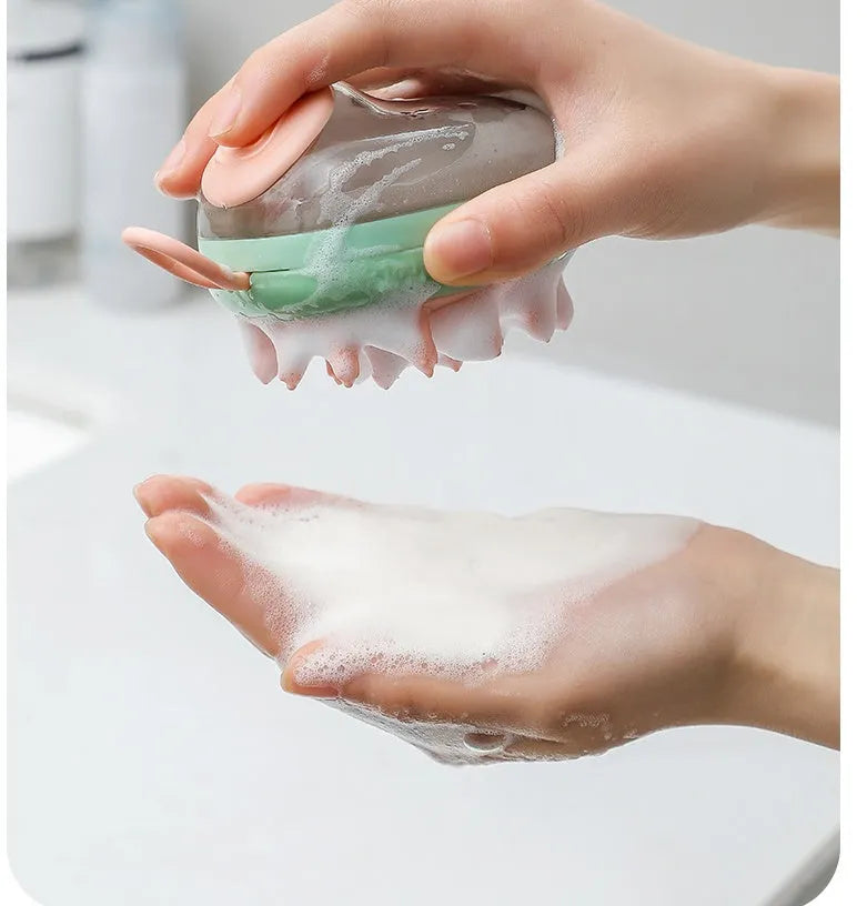 Blue and green pet bathing brush with integrated shampoo dispenser and silicone bristles.