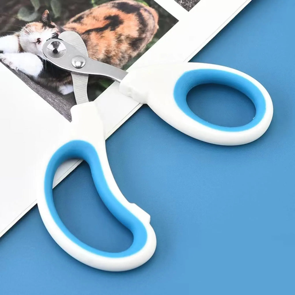 Blue pet nail clippers with a circular hole for the nail, showing the stainless steel blades and cushioned handles.