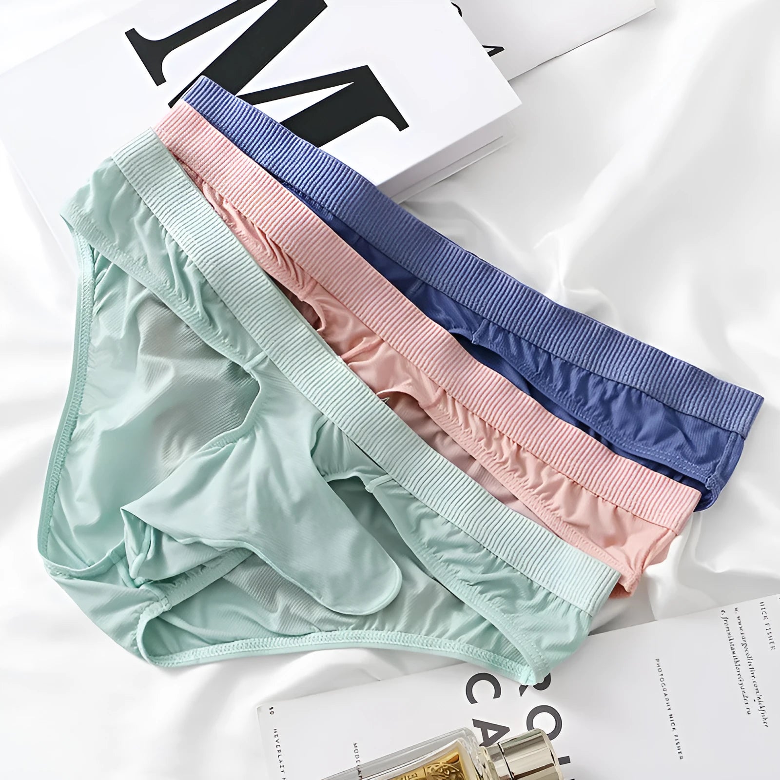 Men's low waist briefs underwear in Ice Silk nylon fabric shown in one of five available colours.