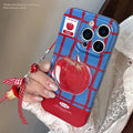 Colour-block checkered 3D fruit phone case for iPhone with blue red grid pattern and red fruit design pendant on a white background