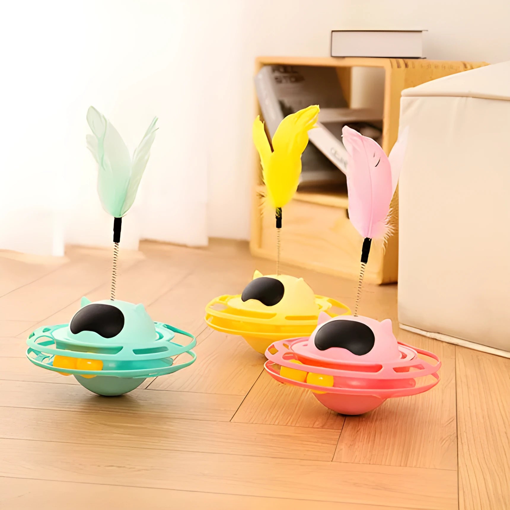 Pink cat stick toy with rotating tumbler turntable measuring 17cm by 10cm