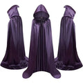A black satin hooded cloak for children, laid flat to show its length, for Halloween wizard or witch costumes.