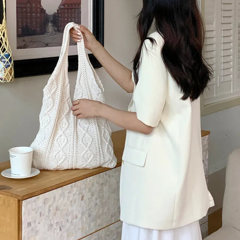 Retro hollow knitted women's shoulder tote bag in a solid colour with double straps.