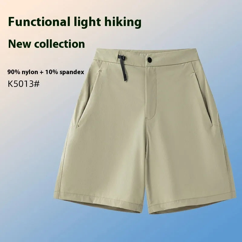 Man wearing army green quick-dry sports shorts with an elastic waistband for running or climbing.