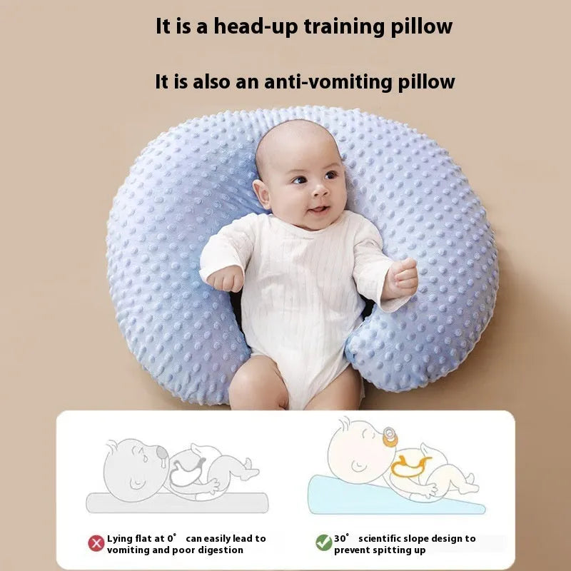 Grey nursing pillow with raised spill guard edge on a white background.