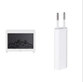 Square black flame effect aromatherapy diffuser with coloured LED lights and mist emitting, remote control beside it.