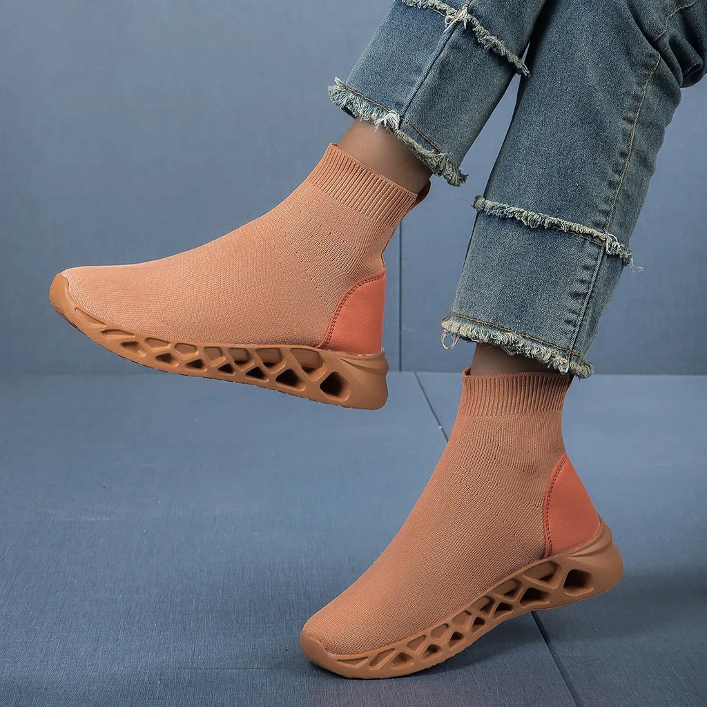 Women's low-top casual mesh slip-on shoe in terracotta colour on a white background.