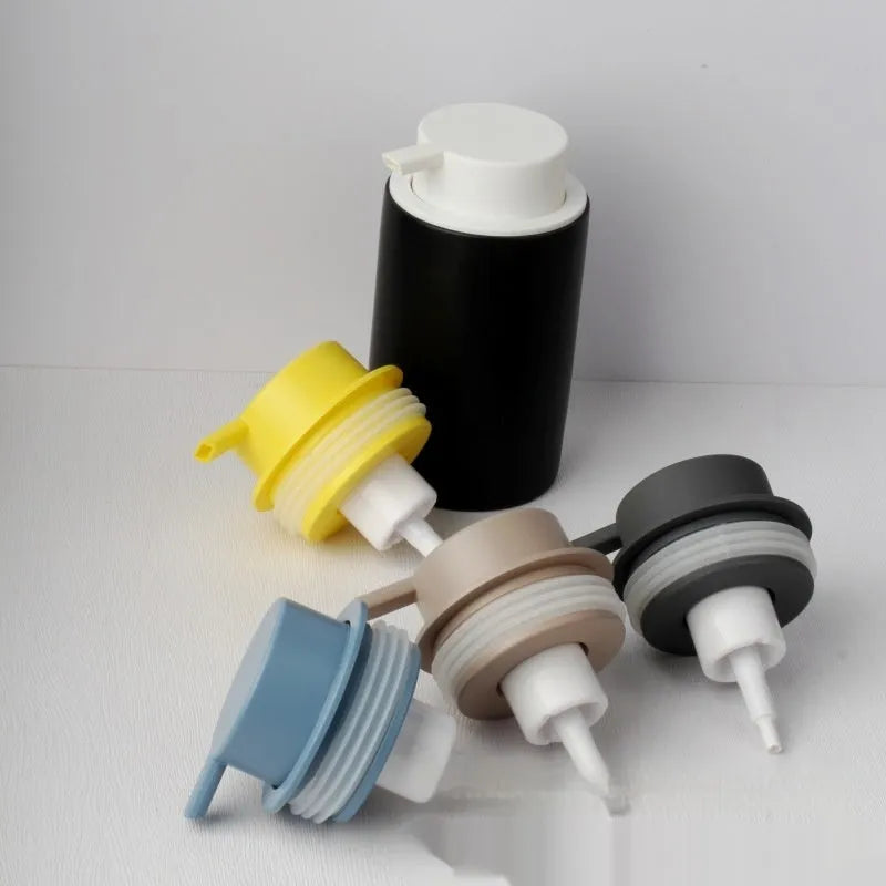 Foam pump for facial cleanser with large hand-push head in gold finish