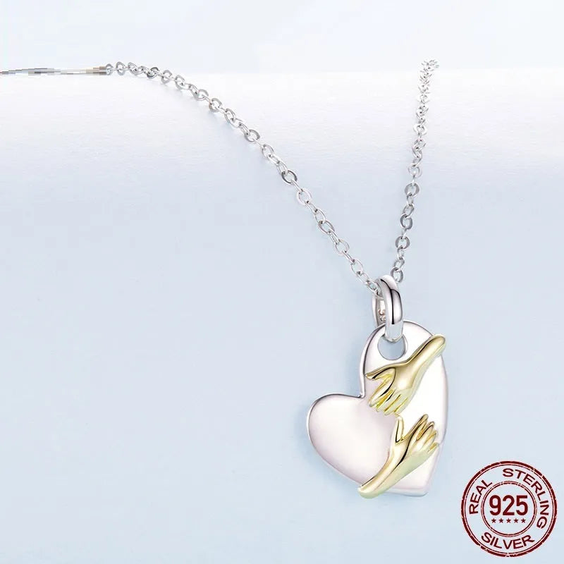 Original Hug Love 925 sterling silver heart necklace with adjustable O-ring chain on white background
