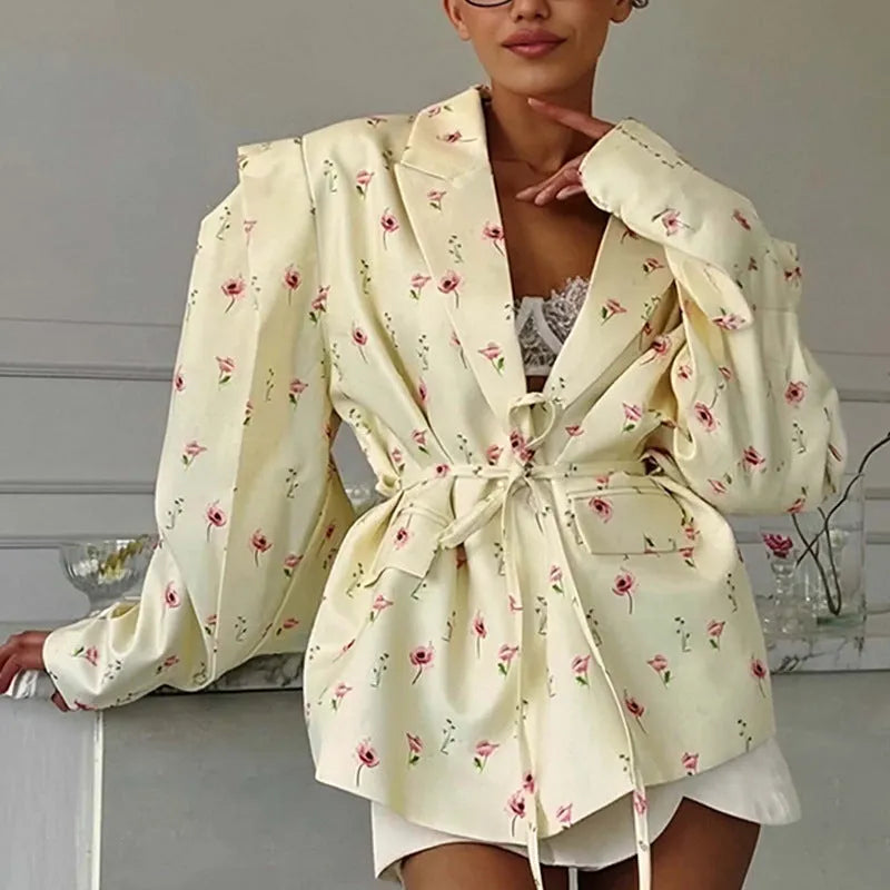 Men's collar suit jacket with a lace-up detail at the waist, shown in a floral print colour.