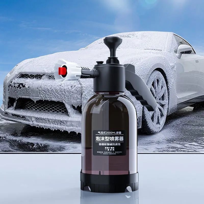 Black hand-held foam sprayer with a 2-litre capacity bottle and pump mechanism.