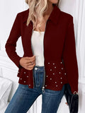 Women's black loose fit coat with a heavy-duty beaded zipper and a ruffled hem.