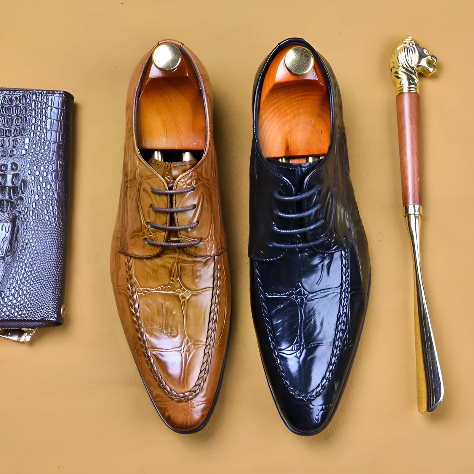 Men's black leather shoes with alligator pattern texture and horse bit buckle detail