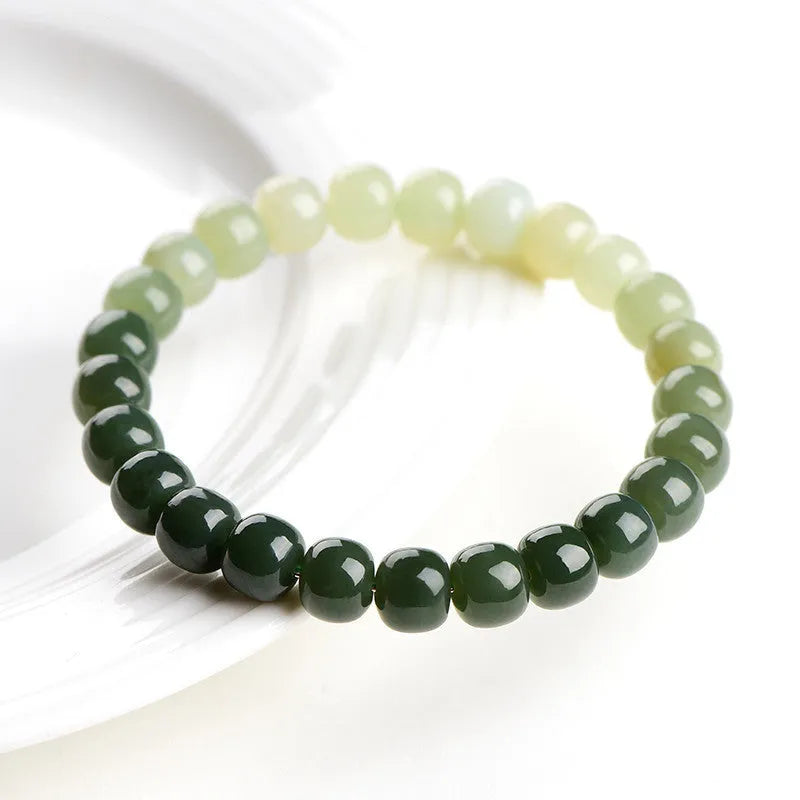 Natural Hetian jade bracelet with water gradient colour on polished beads, unisex casual style.