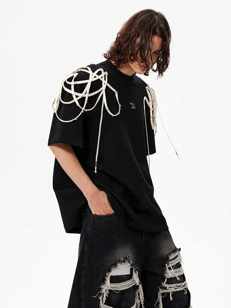 Black short-sleeved T-shirt with padded shoulders and rivet ribbon detail, loose fit with round neck