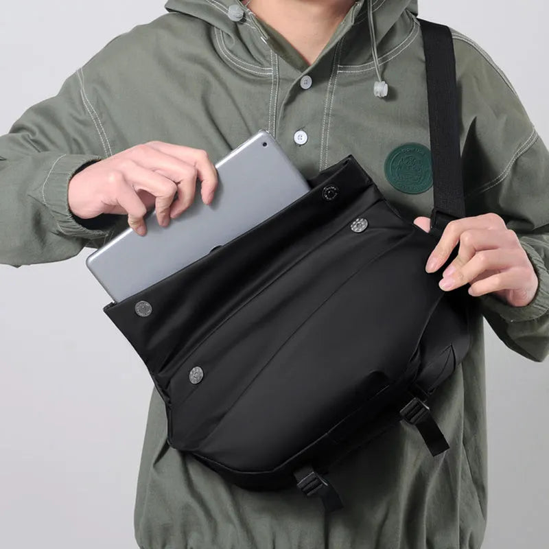 Grey PU leather men's crossbody sling backpack with zip and adjustable strap.