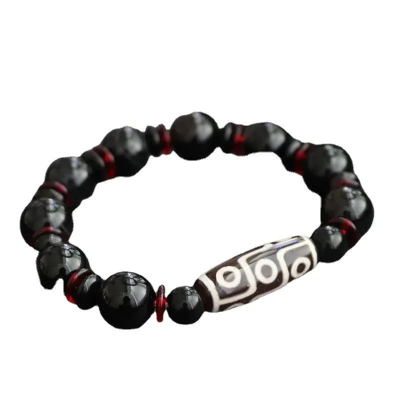 Black agate dzi bead bracelet with 11mm geometric beads in hand-woven construction