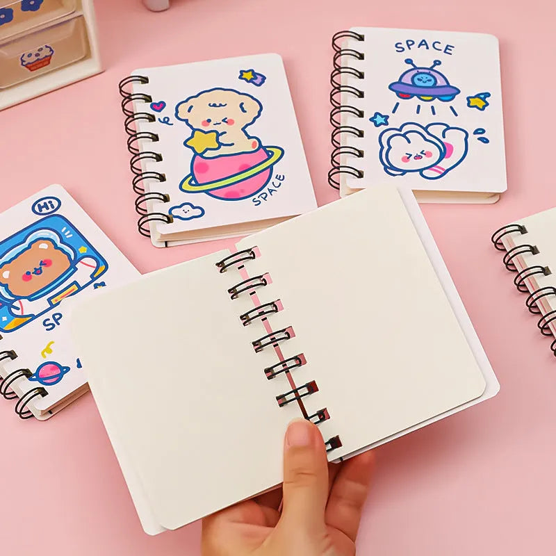 Astronaut-themed pocket flipper notebook showing compact 10.5cm by 8cm dimensions with flip-style binding