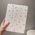 Transparent floral tri-fold tablet protective case with magnetic stand for iPad on white background