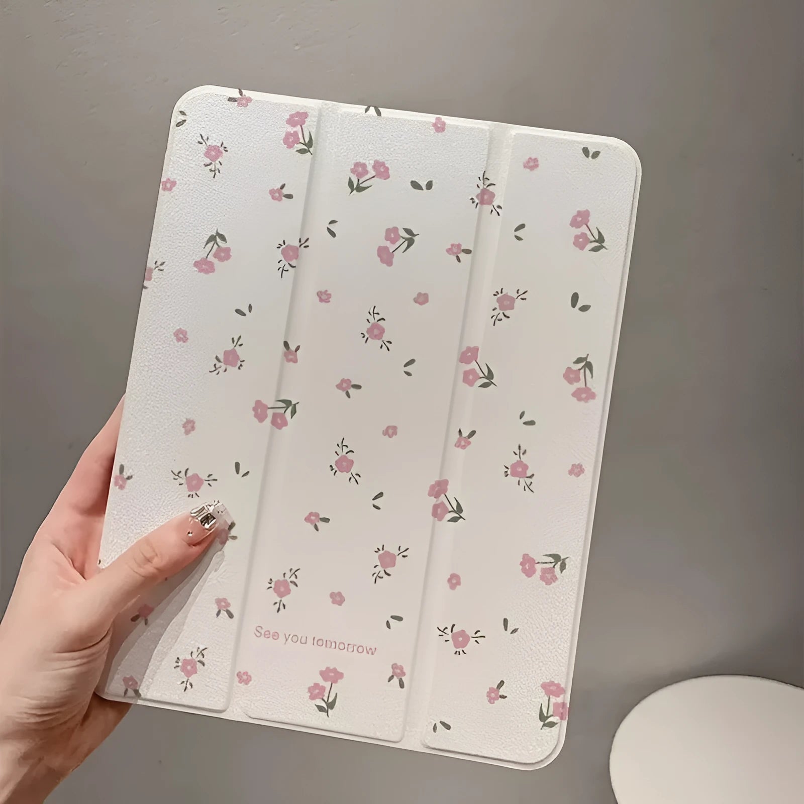 Transparent floral tri-fold tablet protective case with magnetic stand for iPad on white background