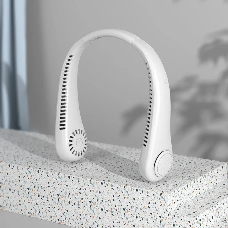 Blue portable bladeless neck fan hanging ergonomically, showing USB charging port and control button.
