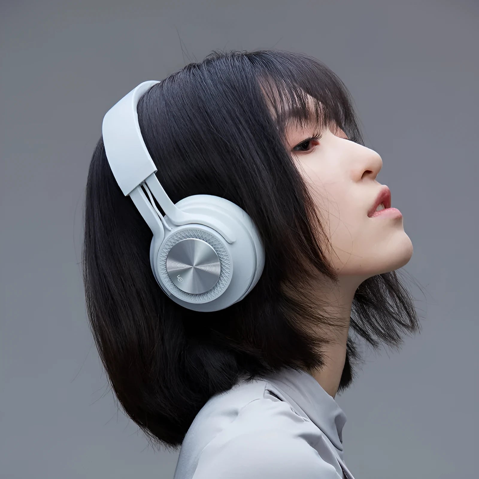 Red sports wireless Bluetooth headset showing earpiece and controls for calls and music.
