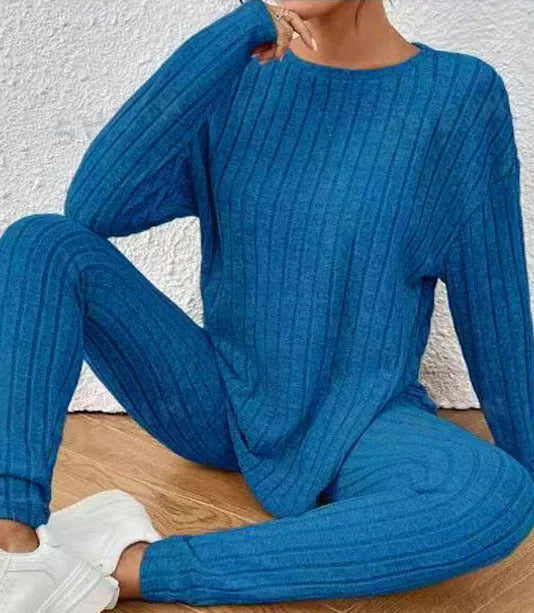 Women's sunken stripe pattern two-piece sportswear set with regular sleeve top and matching trousers