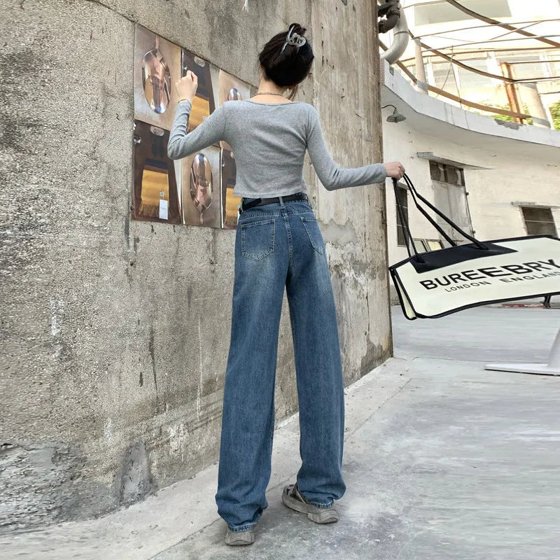 Women's high waist straight leg jeans in retro blue colour on a hanger.