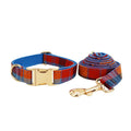 Blue plaid cloth dog collar with attached hand holding rope on adjustable size settings
