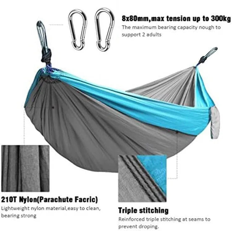 Blue nylon parachute cloth camping hammock hung between trees.