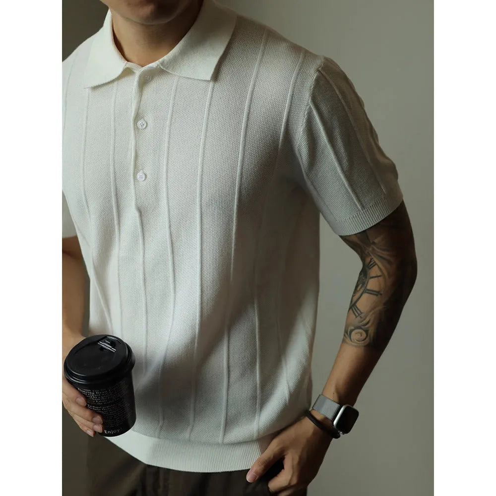 A man's loose-fit solid colour polyester pullover t-shirt on a hanger, shown in black and white colour options.